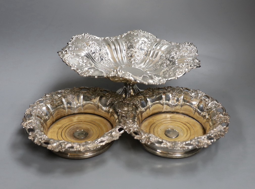 A pair of Victorian Sheffield plate wine coasters and plated comport, 13 cms high.